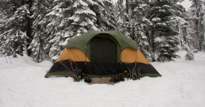 tent set up for winter camping on the snowy ground