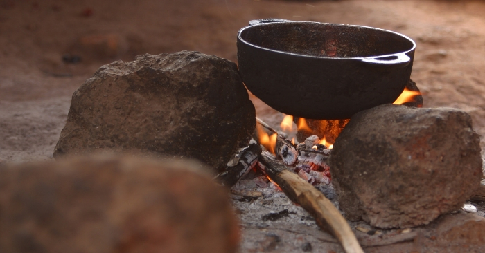 cast iron pan on a campfire