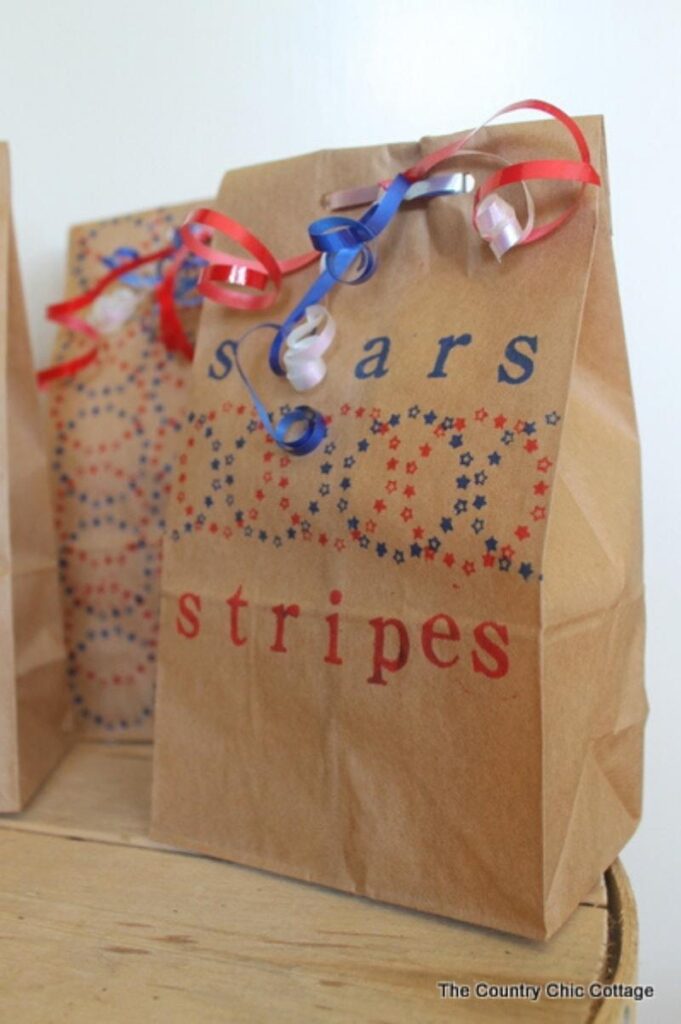 Brown paper bag decorated with patriotic stamps and ribbons
