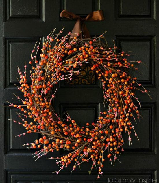 DIY rustic fall wreath hanging on a door