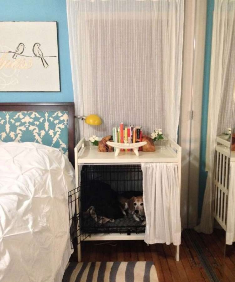 Old white repurposed changing tables redesigned to fit a small wire dog crate hide-a-way