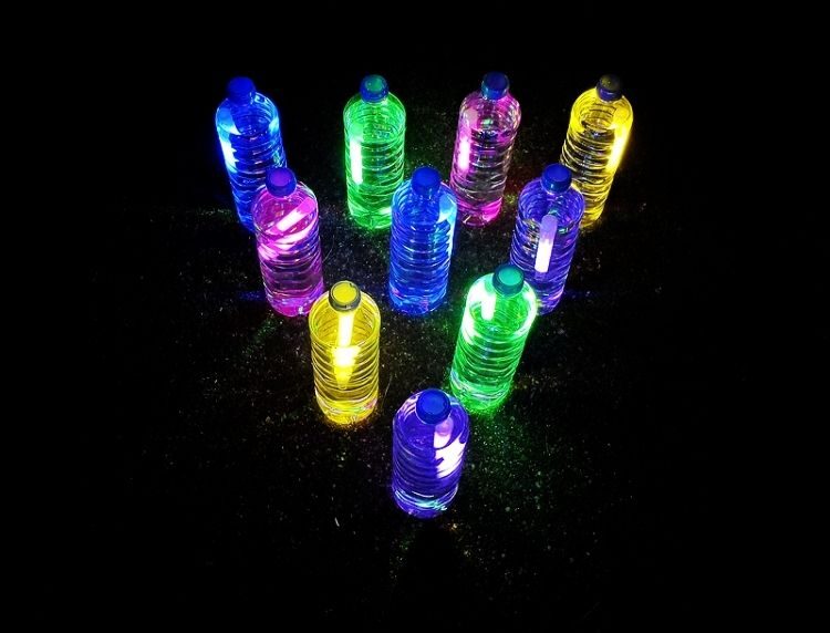 glow in the dark bowling using water bottles and glow sticks