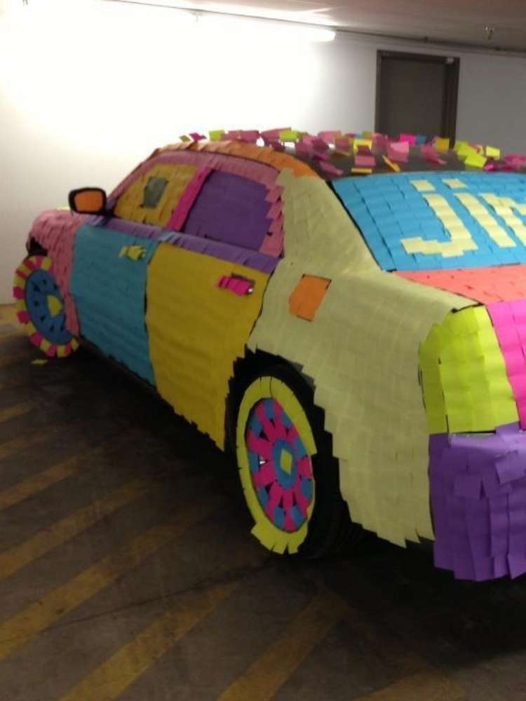 Fun Birthday Prank Ideas- Picture of car covered in colorful post-it notes as a prank