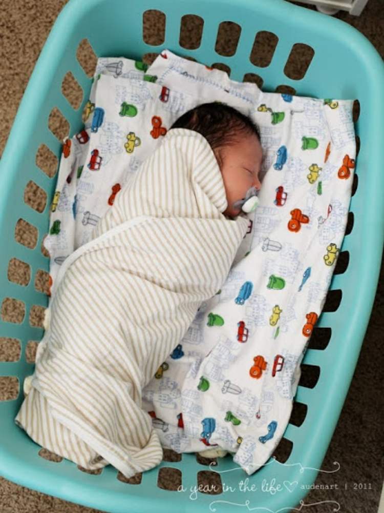 Picture of baby sleeping in laundry basket