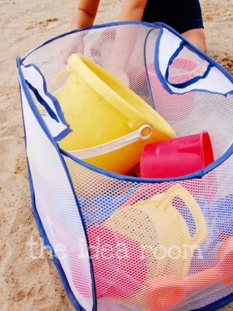 Picture of mesh laundry bag being used as a beach toy storage