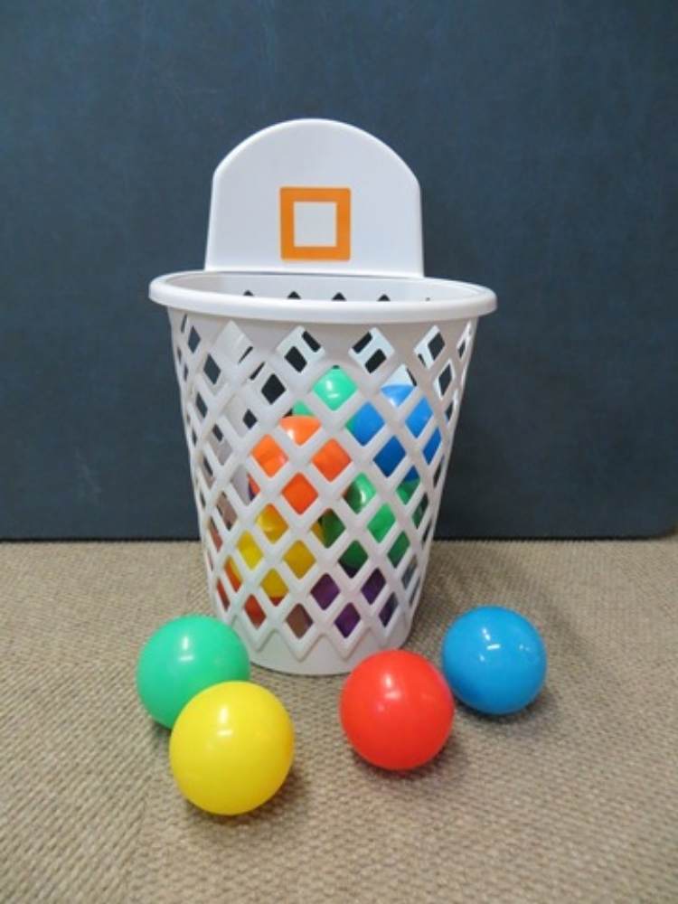 Picture of laundry basket being used as a basketball hoop