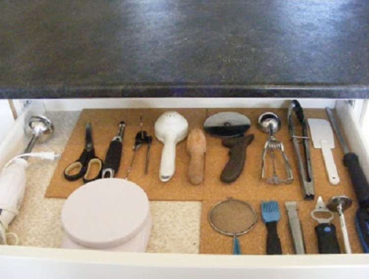 One Crazy House how to Organize Kitchen open drawer with cork board underneath utensils