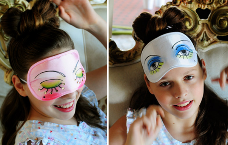 DIY painted sleep mask craft - girl wearing sleep masks she decorated