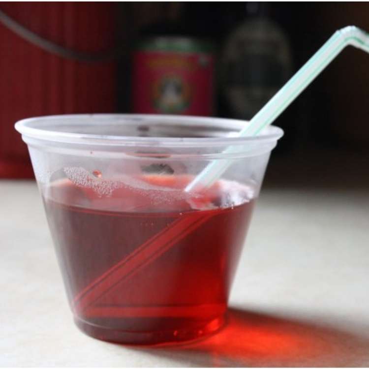 April fools prank, red jello in a cup with a straw