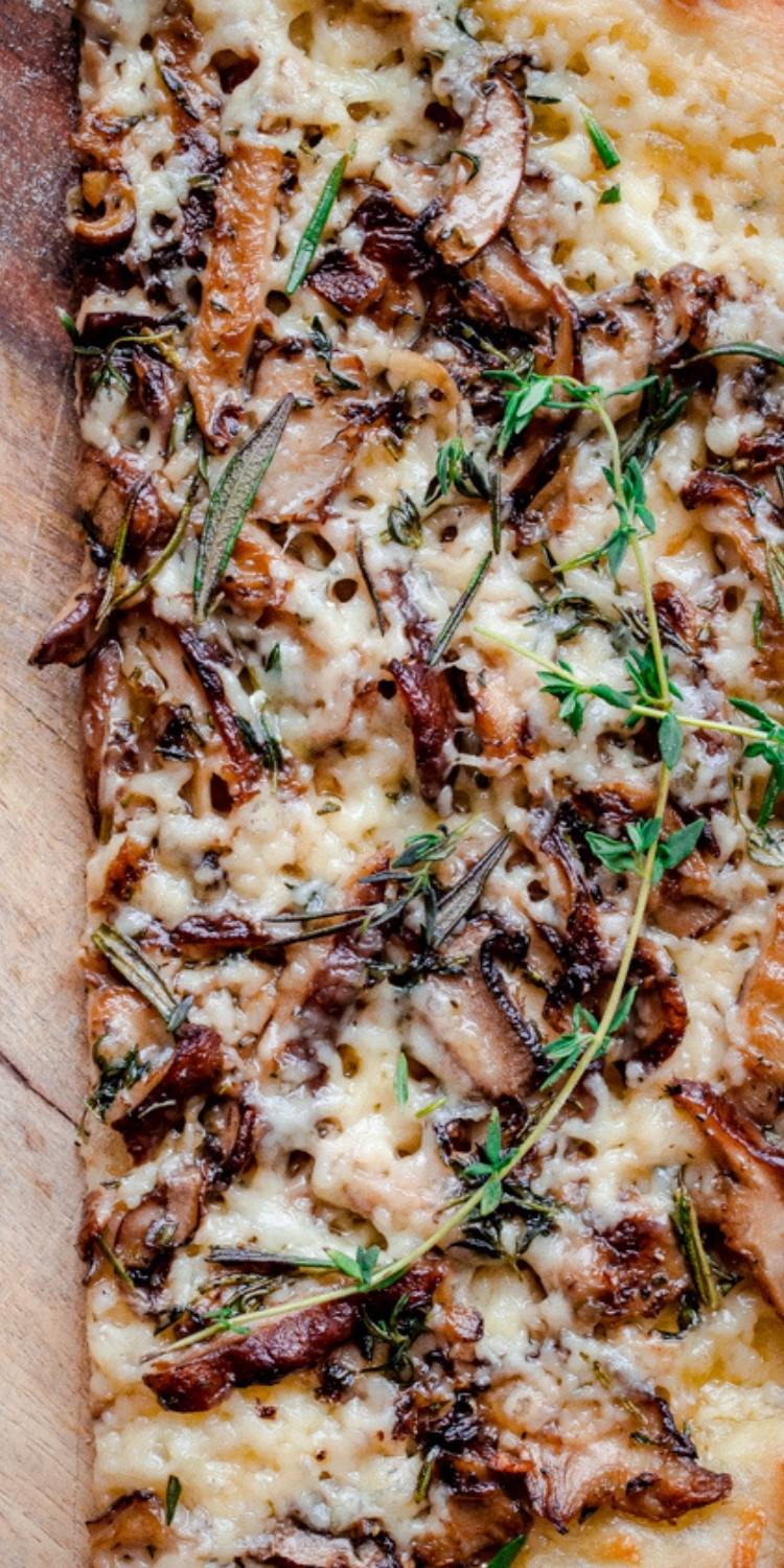 Unique mushroom and havarti cheese pizza topped with sage and rosemary herbs. Fun Flavors for pizza toppings.