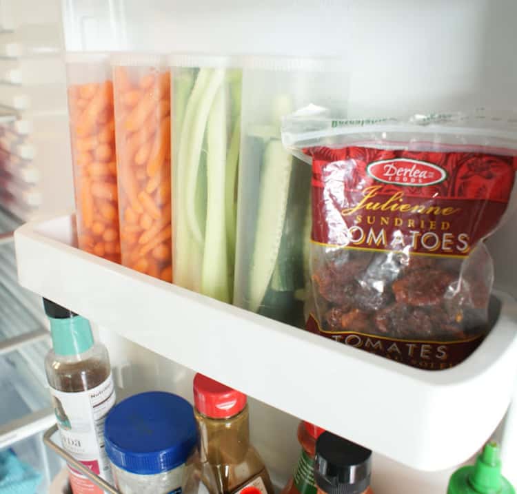 Maximize your fridge space by storing cut veggies in vertical containers