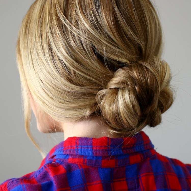  woman with blonde hair in a loose bun in the back