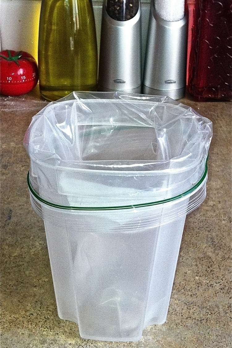 tall Tupperware container with crockpot liner as accessory