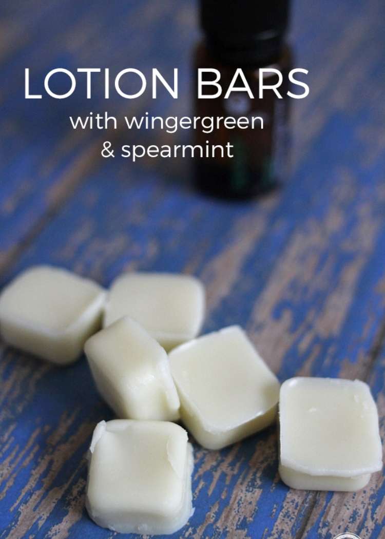 white lotion bars on top of a wooden table 