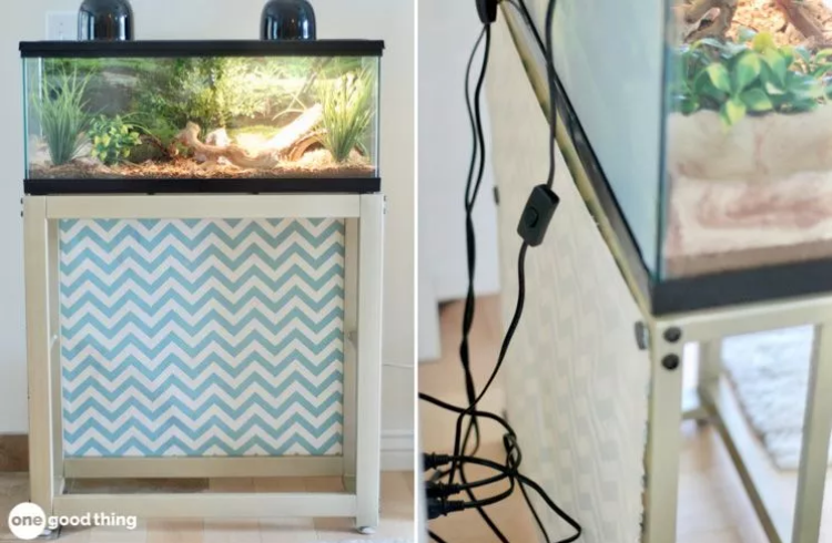 a snake terrarium with fabric attached to the metal stand using magnets for cable management