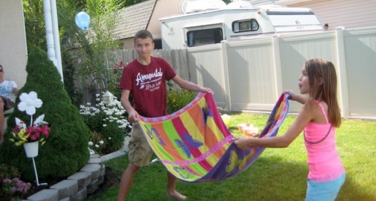 water balloon toss with towel 