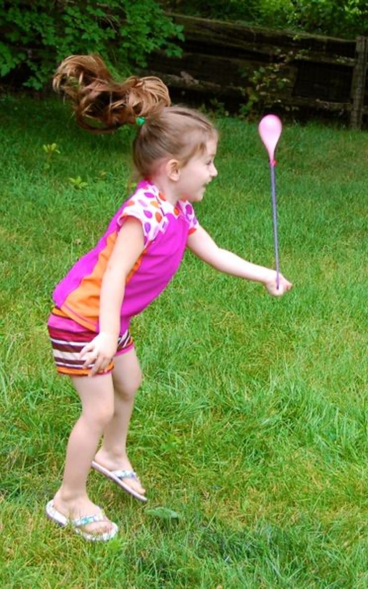 Girl playing with Yo yo water balloons