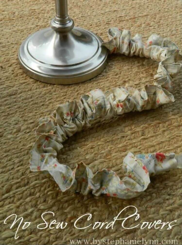 A lamp cord wrapped in ruffled fabric to hide the cable