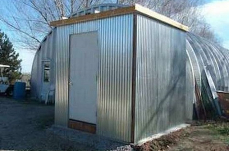 Backyard shed converted into an all metal walk-in cooler