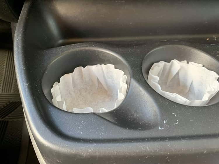 Cup cake liners for storing dirt in cars