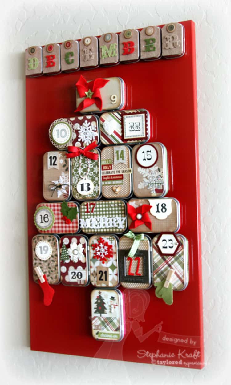 Advent calendar hanging on the wall made from altoid tins shaped into a Christmas tree.