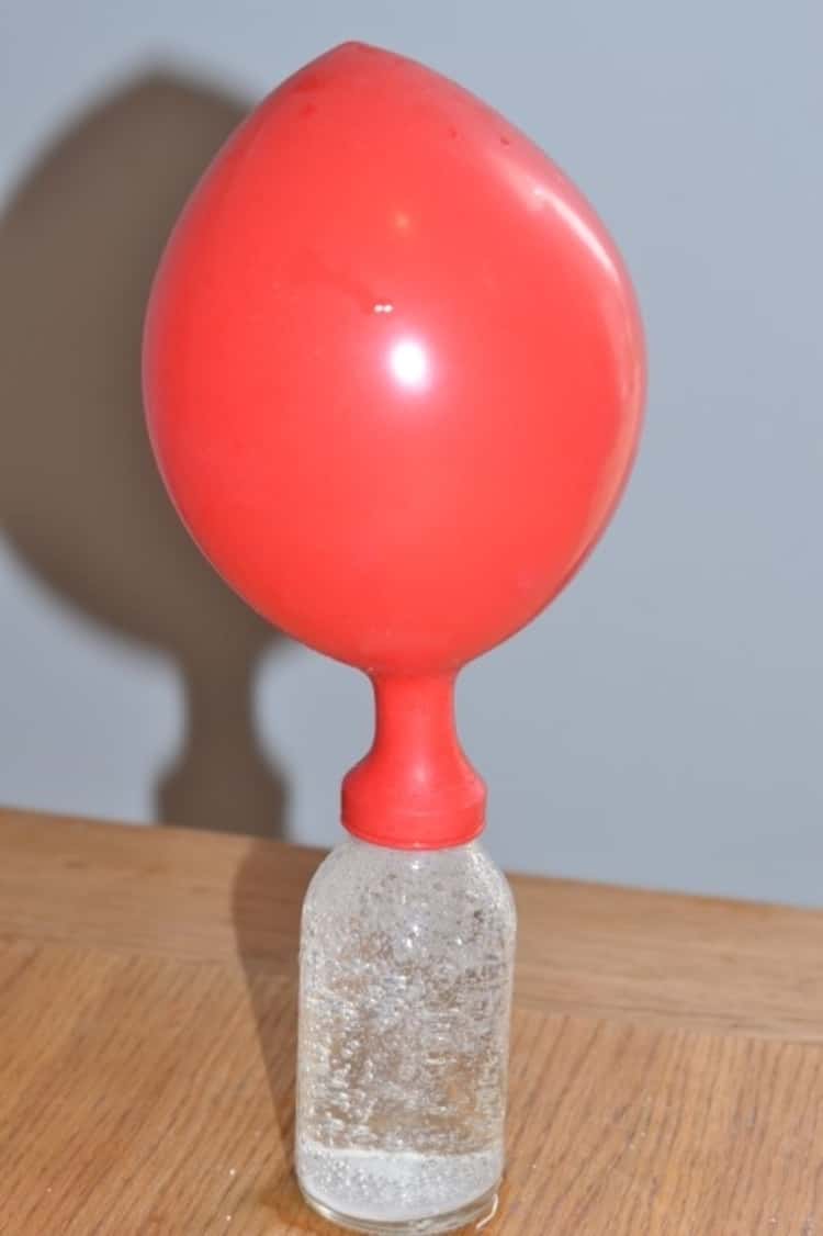 A photo illustrating how to blow up a balloon using water and alka-seltzer