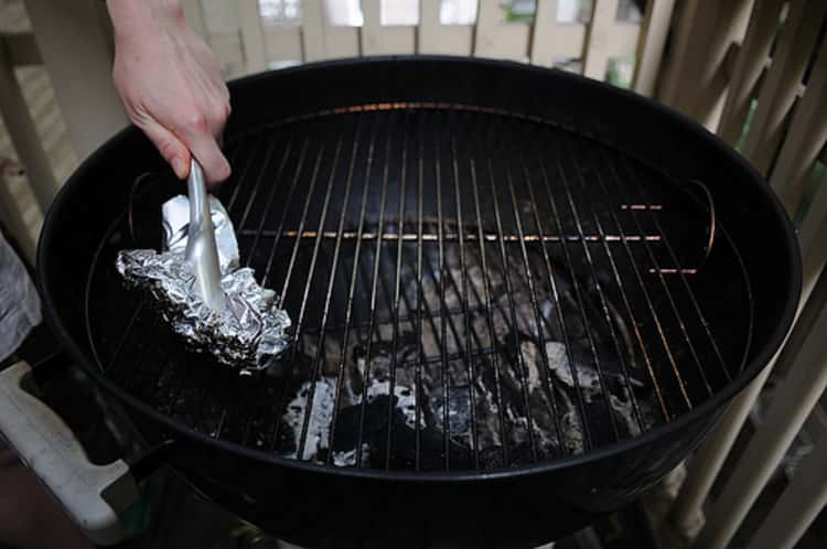Use aluminum foil to scrub down your grill