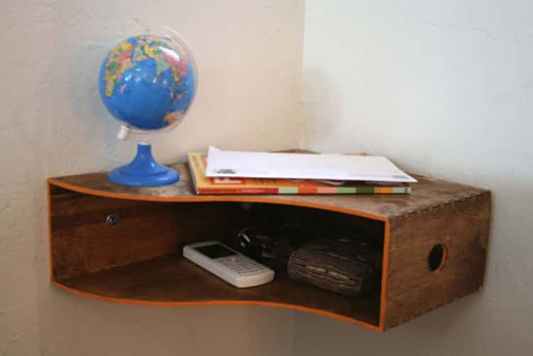 wooden magazine holder flipped sideways and attached to a corner as a catch all shelf