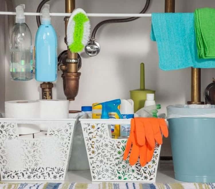 Use plastic bins to organize together like-cleaning supplies