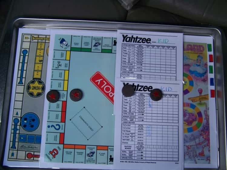 A cookie sheet used to carry a Monopoly Board and other games for travel