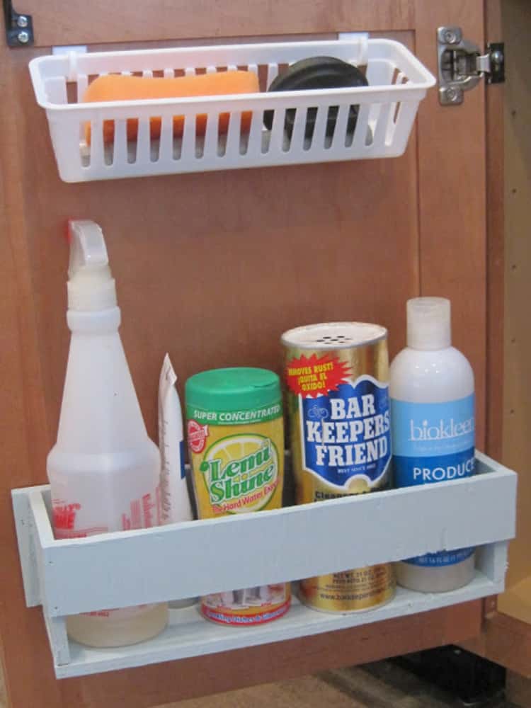 Door mounted caddies for the under-the-sink cabinet