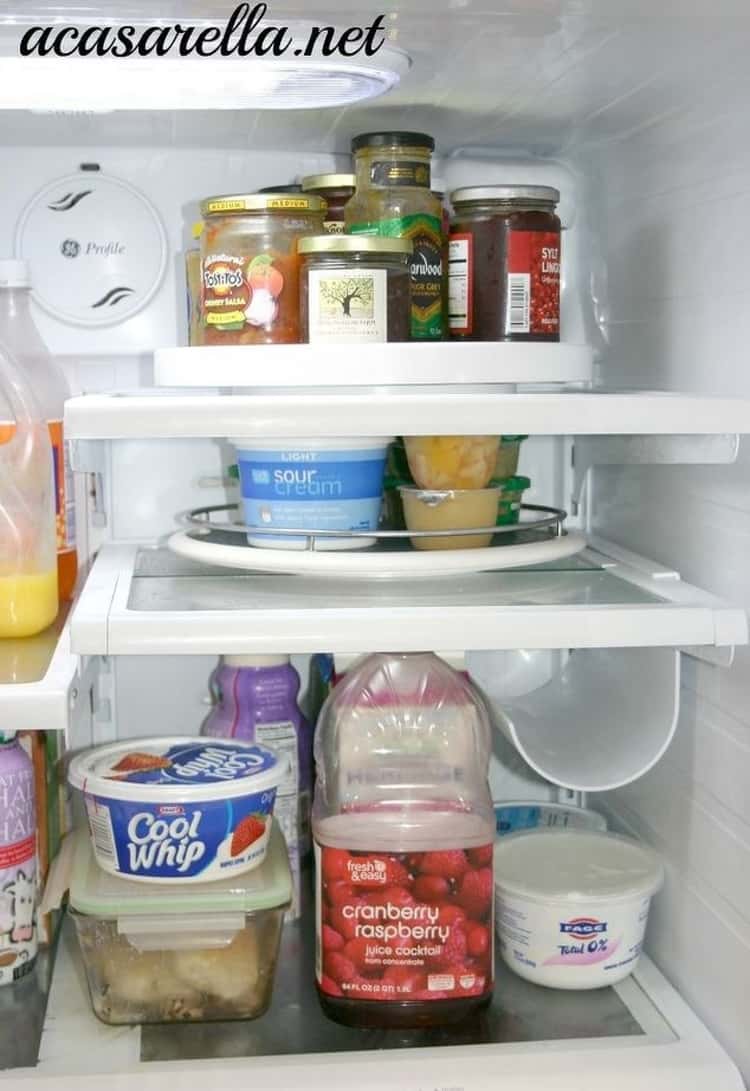 Open fridge showing condiments organized on Lazy Susans 