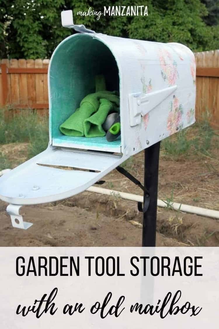 an old mailbox decorated with flowers and used to hold garden tools, the front if open.
