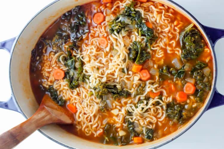 A bowl of ramen noodle vegetable soup