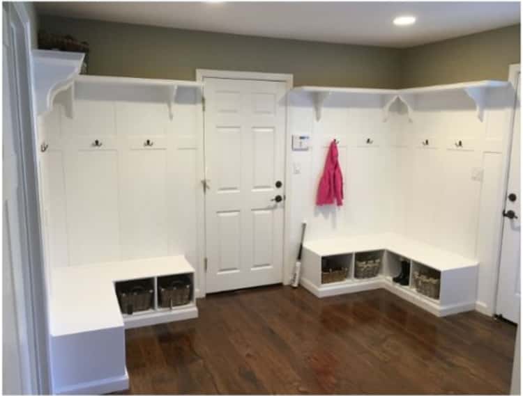 Mudroom with added lockers and shelves on either side of the door in the middle. taking up both corners in the room
