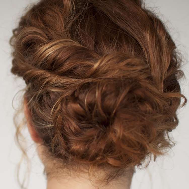 easy bun hairstyles for curly hair. brown curly hair in a bun