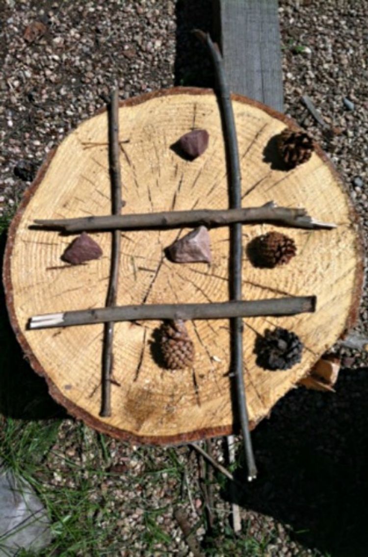 tic tac toe game made of log branches and acorn