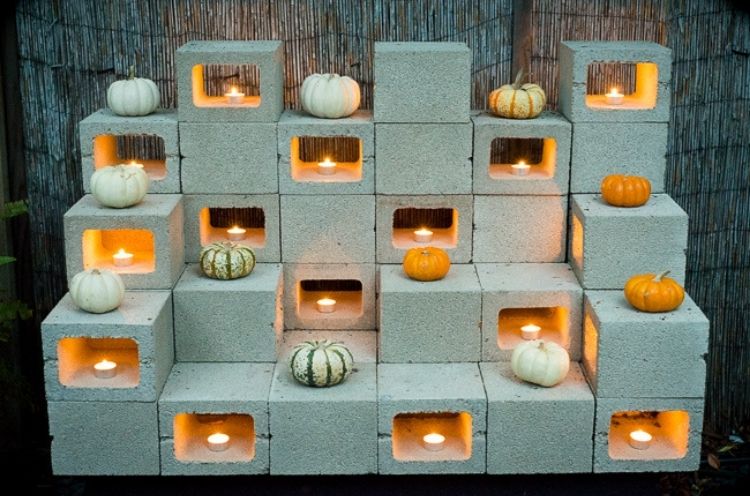 This cinder block fixture is a clever way to add some soft lighting to your patio area with you don't have lights. 