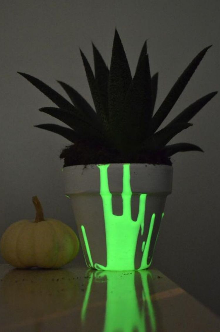 This deck idea helps house your plants and add light. Use this glow-in-the-dark paint to illuminate your planter pots on your deck at night. 