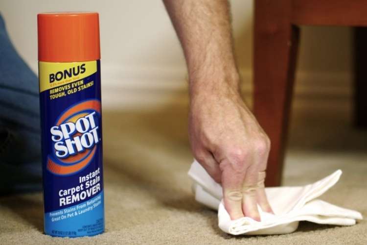 OneCrazyHouse Spring Cleaning can of spot shot next to a hand pressing a towel into carpet