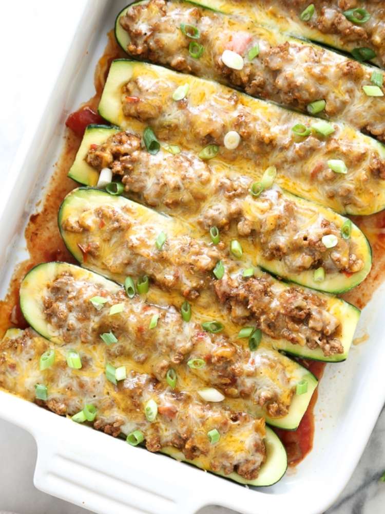 OneCrazyHouse ground turkey recipes zucchinni slices stuffed with taco seasoned ground turkey topped with melted cheese in baking dish
