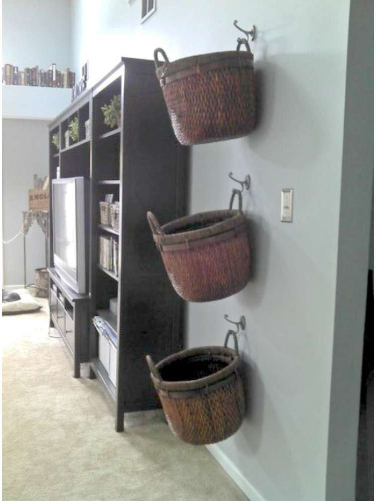 OneCrazyHouse kid friendly living room ideas Baskets hanging on the wall used as storage