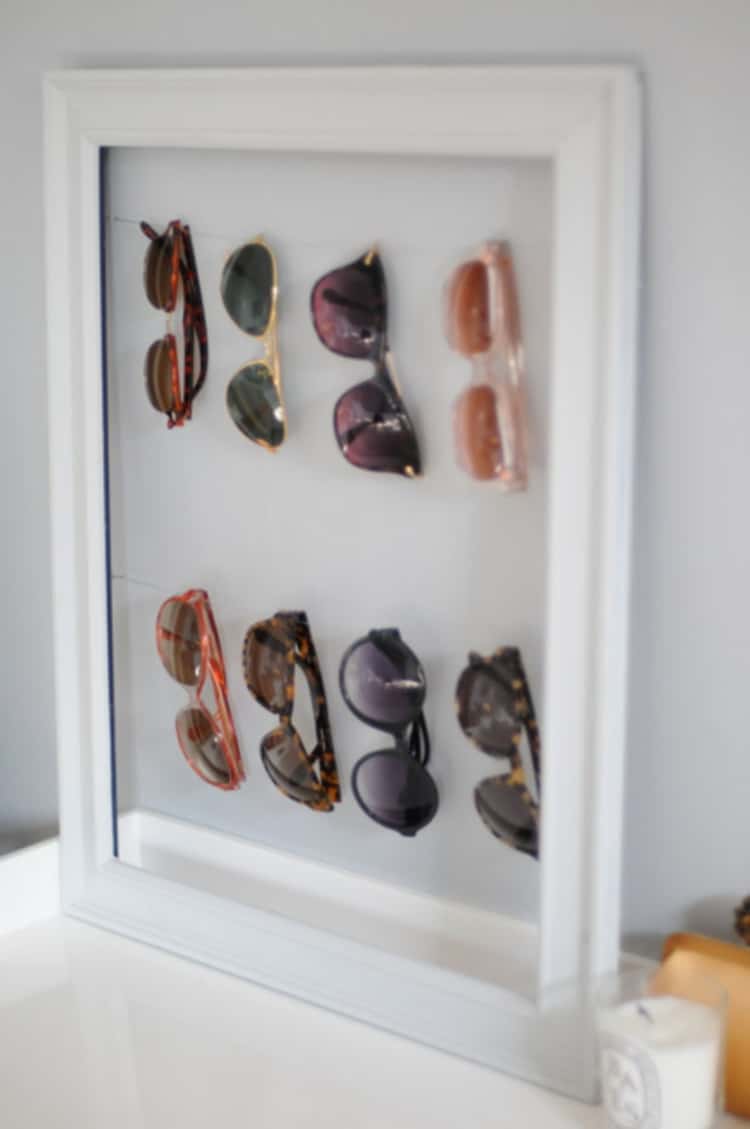 Sunglasses hanged on a picture frame