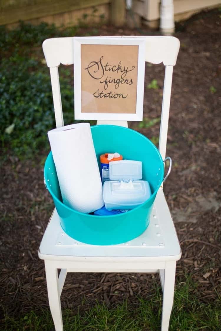 A sticky fingers station where guests can find wipes, hand sanitizer and paper towels