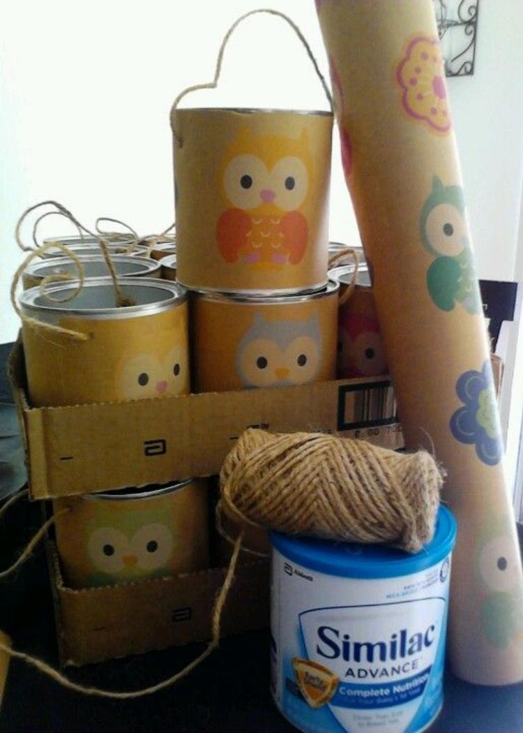 upcycled formula canisters featuring fun and colorful owls, turned into party favor buckets. 