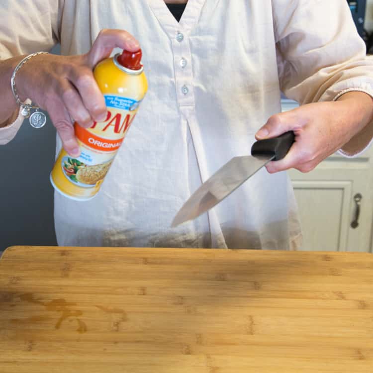 Cooking spray used to coat a knife.