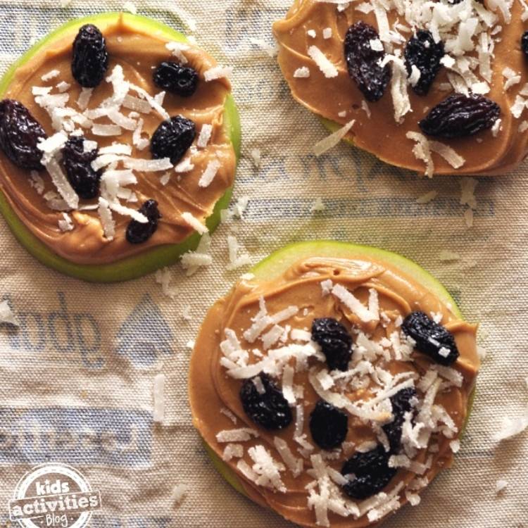 apple low carb snacks layered with peanut butter raisens and coconut