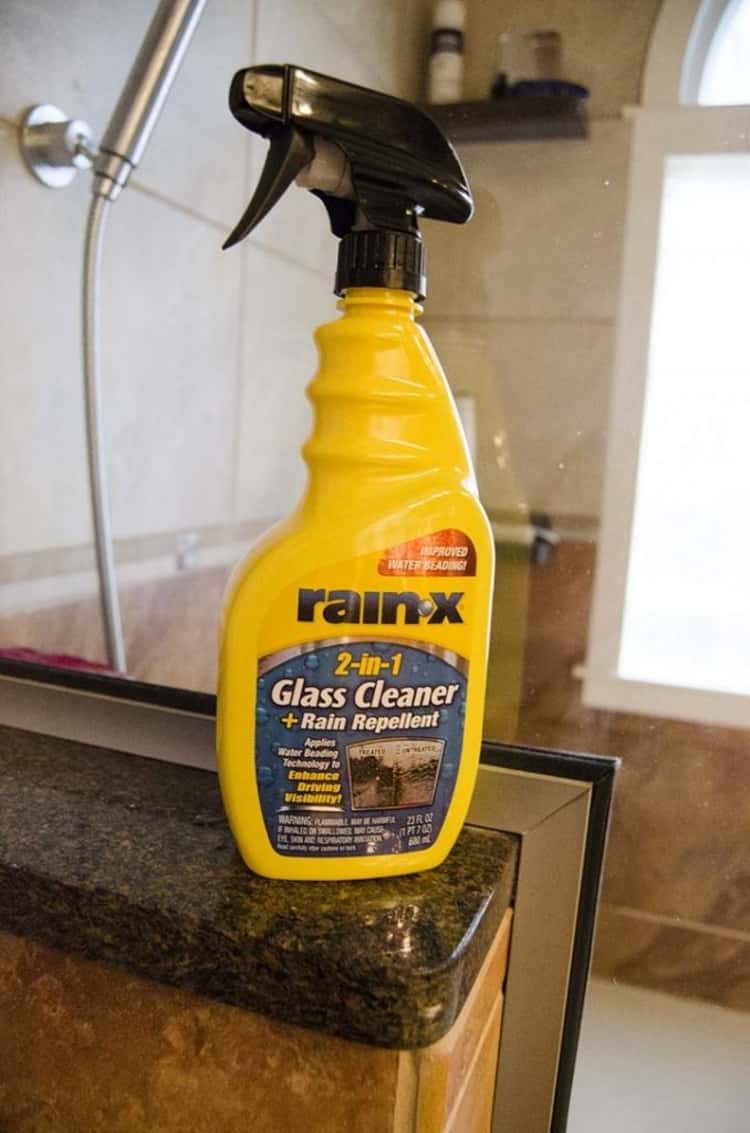Bottle of Rain-X glass cleaner sitting by shower 